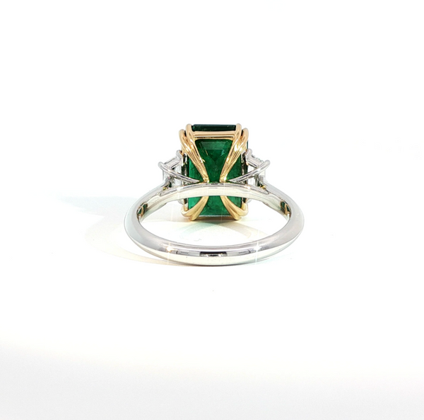 Elongated Emerald Cut Emerald and Diamond Bezel Set Trilogy Engagement Ring