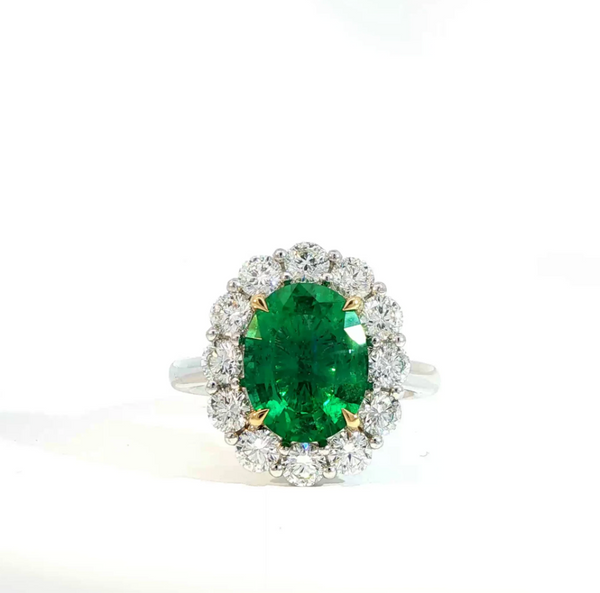 Oval Cut Emerald and Diamond Halo Engagement Ring