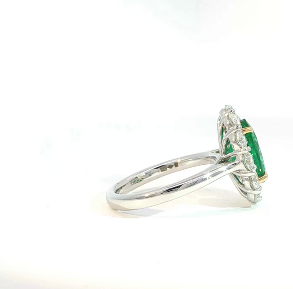 Oval Cut Emerald and Diamond Halo Engagement Ring