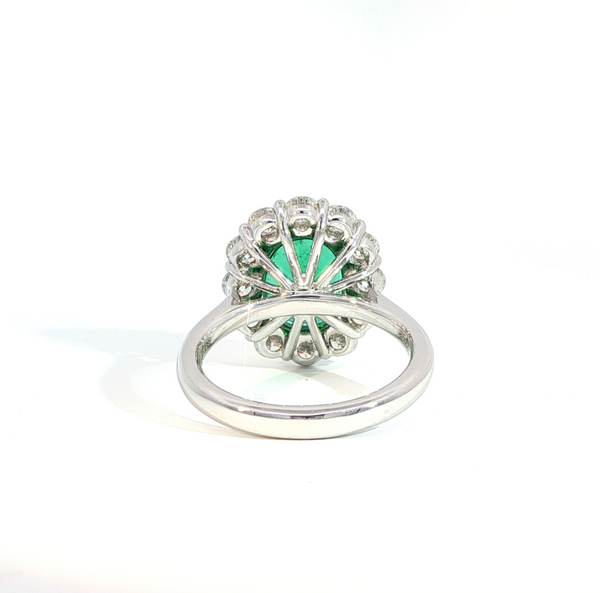 Oval Cut Emerald and Diamond Halo Engagement Ring
