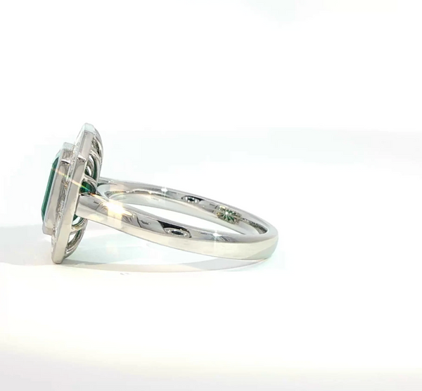 Emerald Cut Emerald and Diamond Bezel Halo Engagement Ring